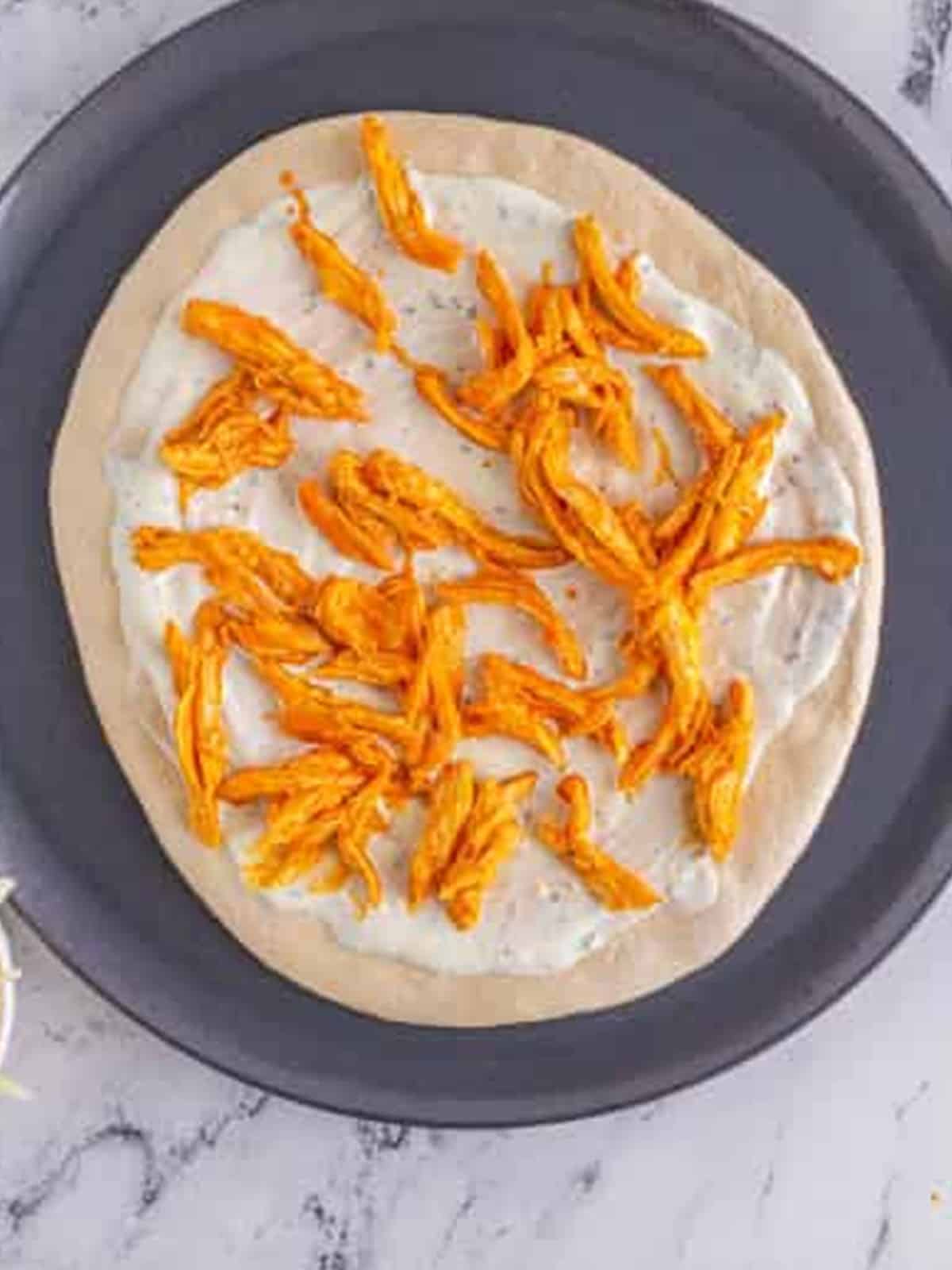 Buffalo chicken pizza baked with golden crust and melted cheese.