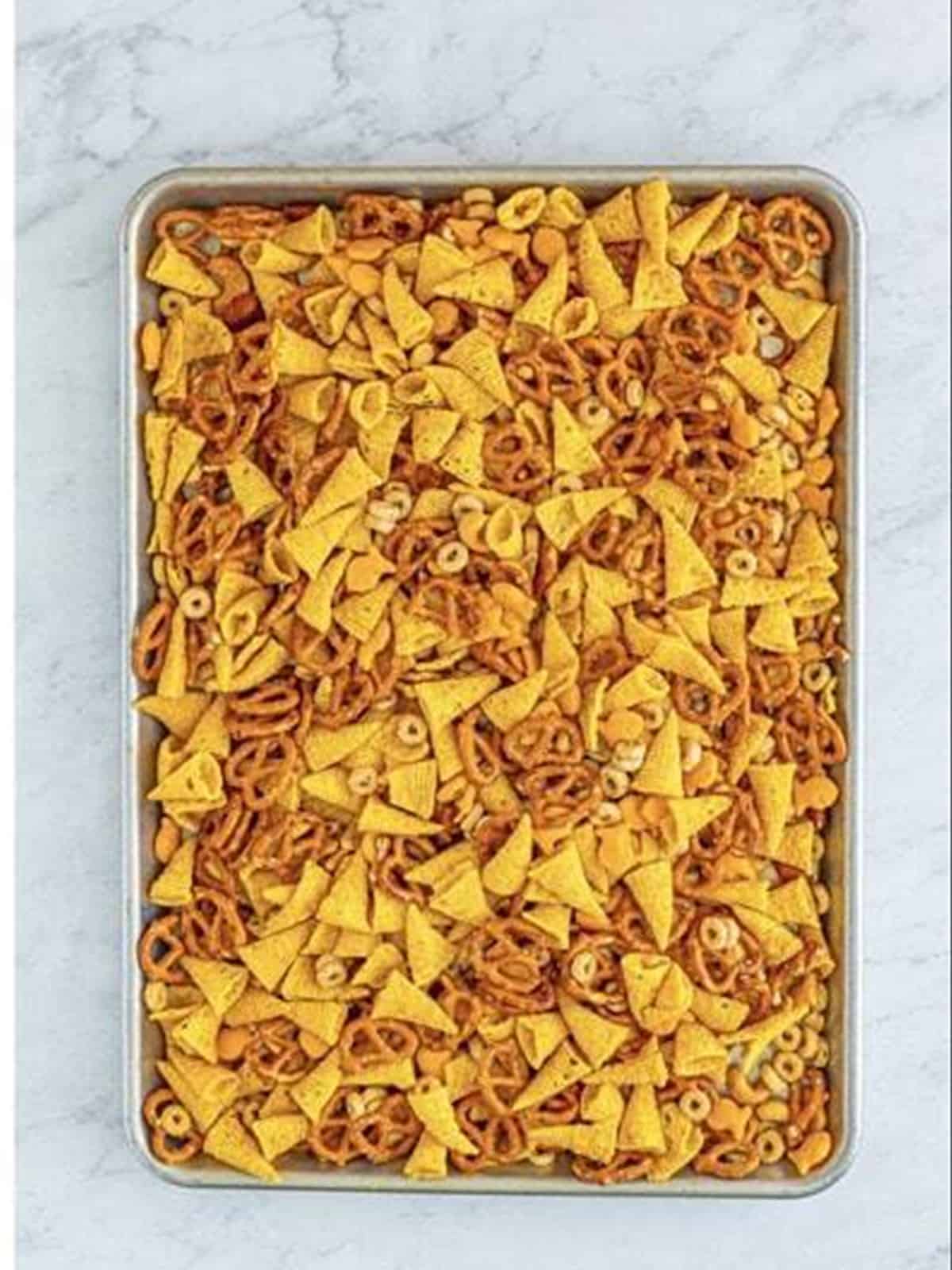 Baked Bugles ranch snack mix golden on the tray.