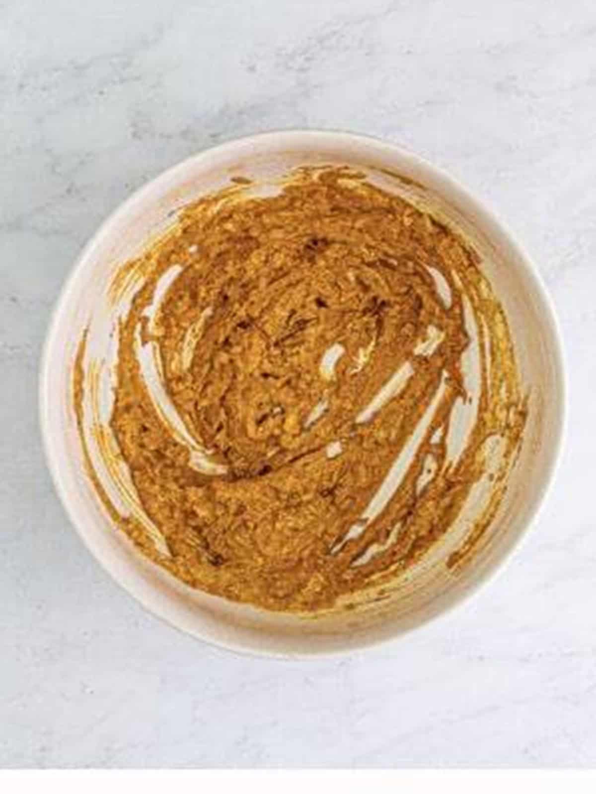 The butter chicken marinade whisked smooth with all the spices blended in.