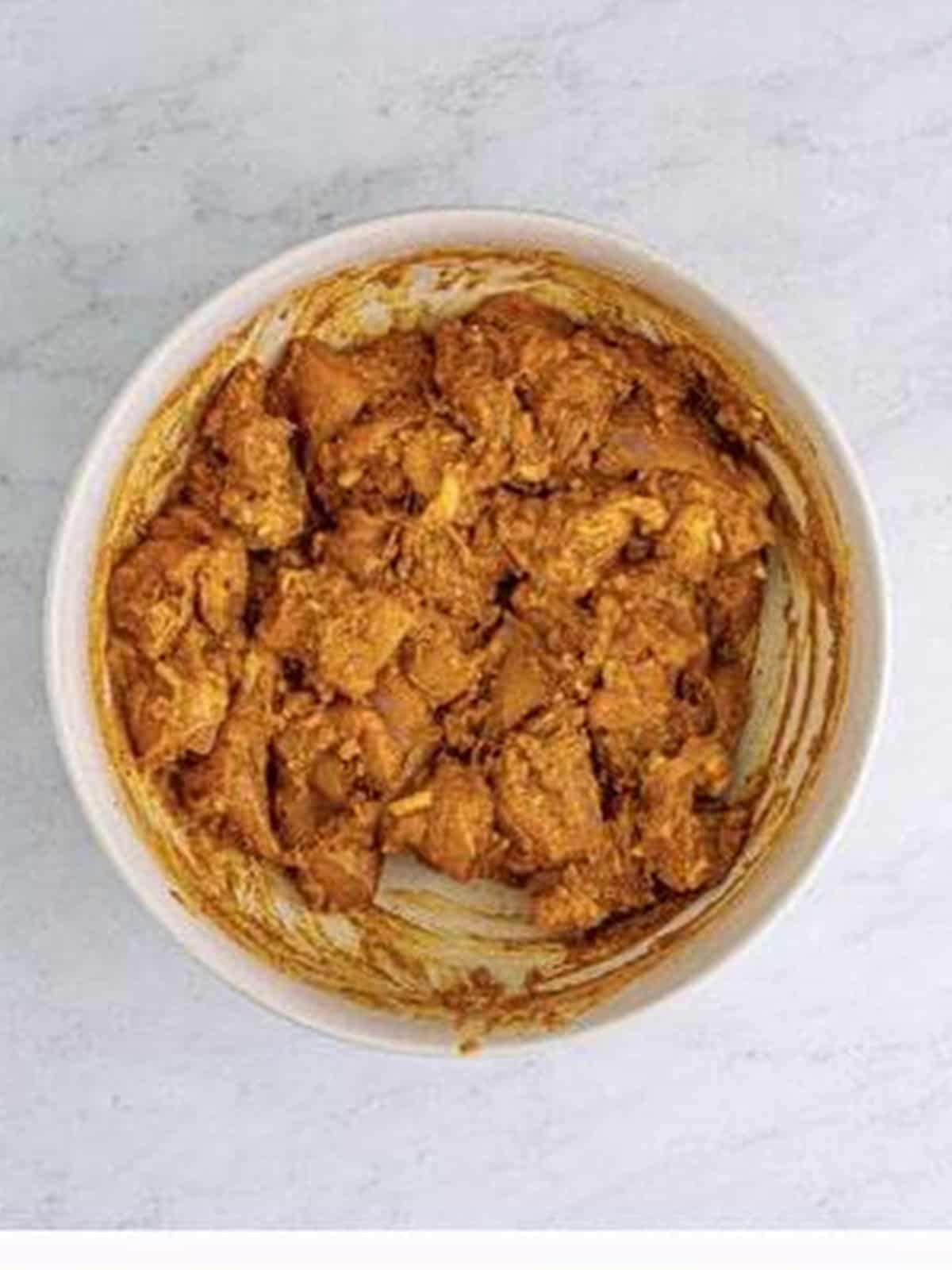 Bite-sized chicken thighs tossed in the spiced yogurt butter chicken marinade.