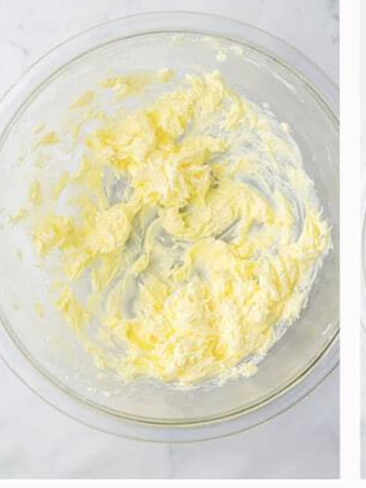 Butter creamed until smooth in a glass bowl for butterfinger cookies.