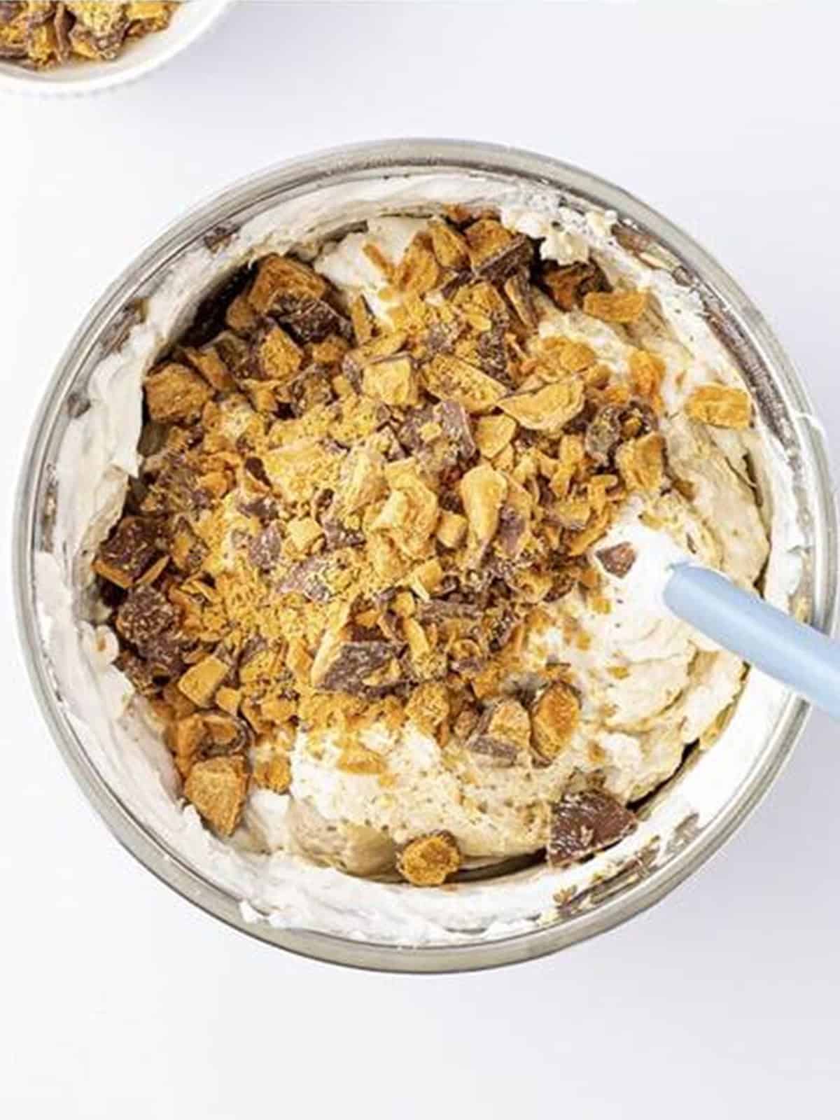 Chopped Butterfinger candy added to the cheesecake filling.