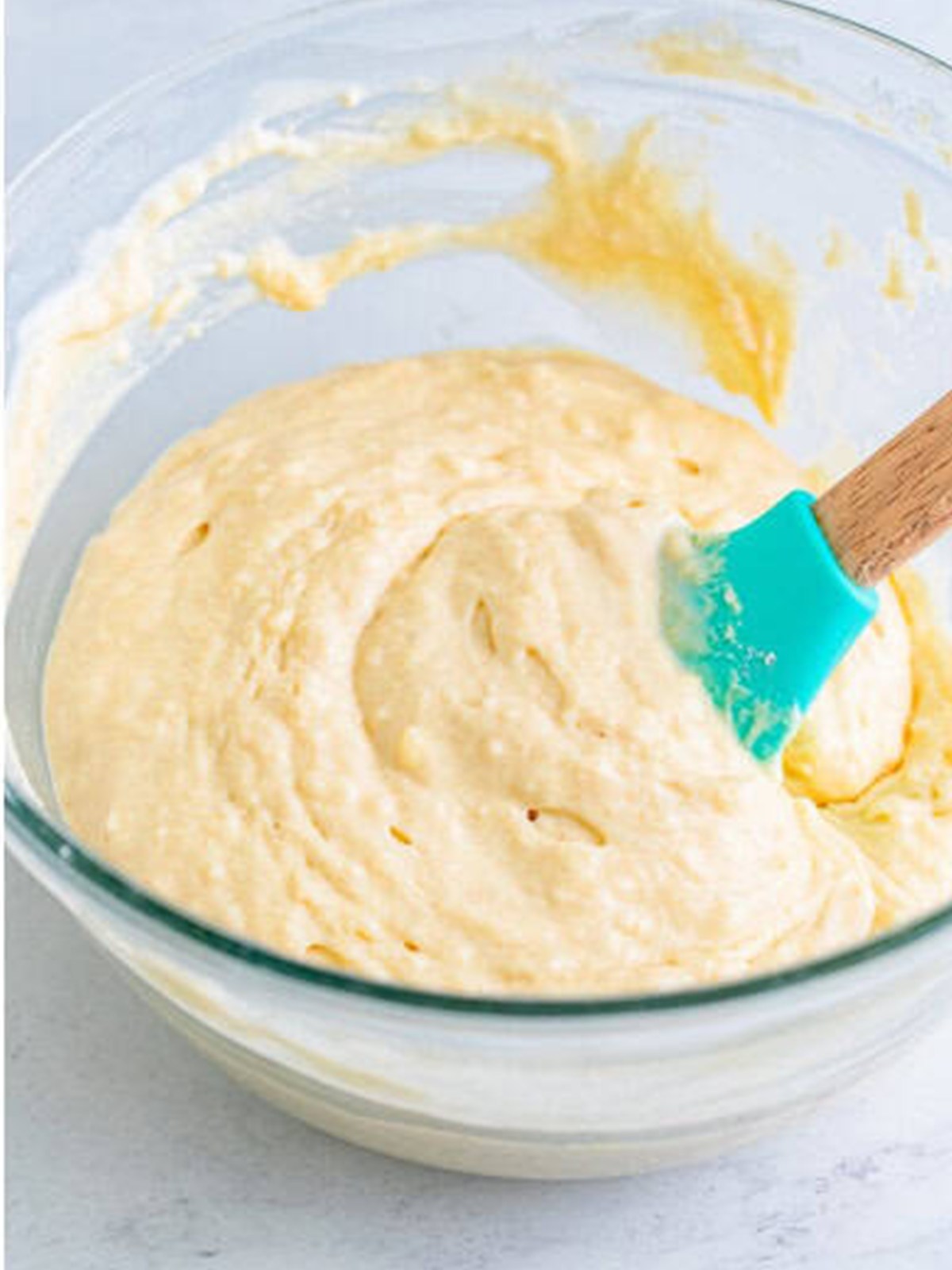 Gently mixed Buttermilk Pancakes batter in a glass bowl.