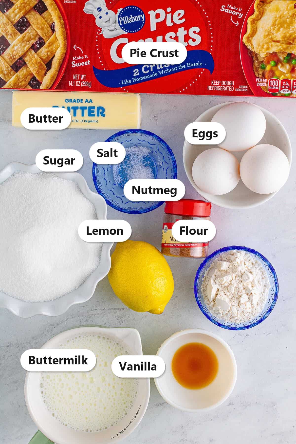 Buttermilk Pie ingredients labeled: pie crust, butter, eggs, sugar, flour, lemon, nutmeg, salt, vanilla, and buttermilk.