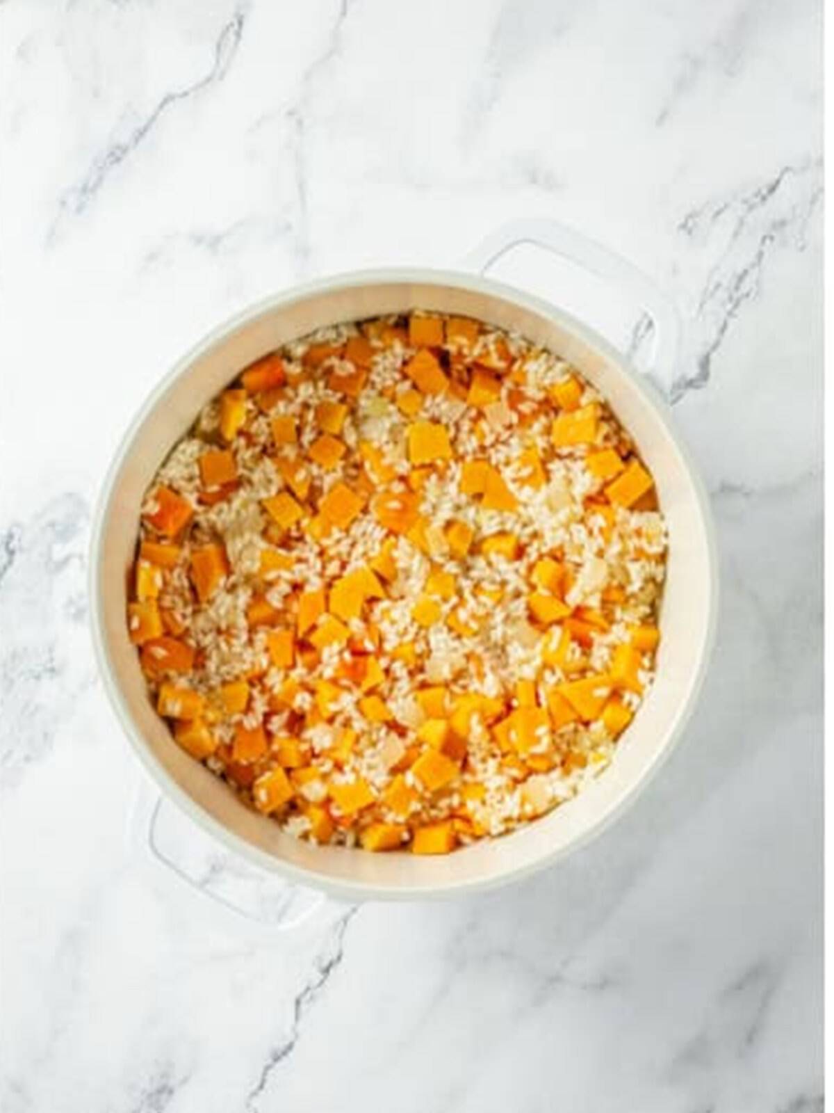 Diced butternut squash stirred into the toasted risotto rice.