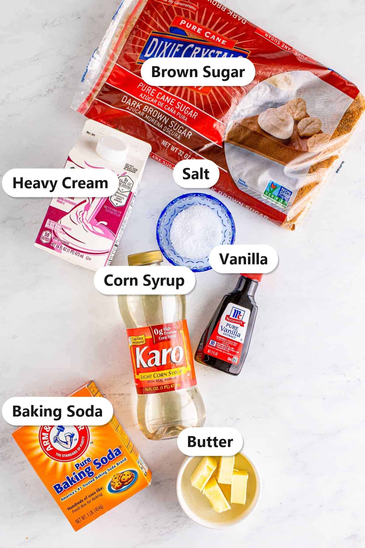 Labeled ingredients for butterscotch sauce including dark brown sugar, heavy cream, butter, corn syrup, vanilla, and salt.