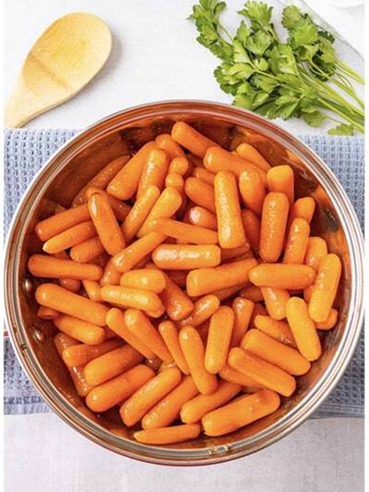 Baby carrots tossed and cooking in the brown sugar cinnamon glaze.