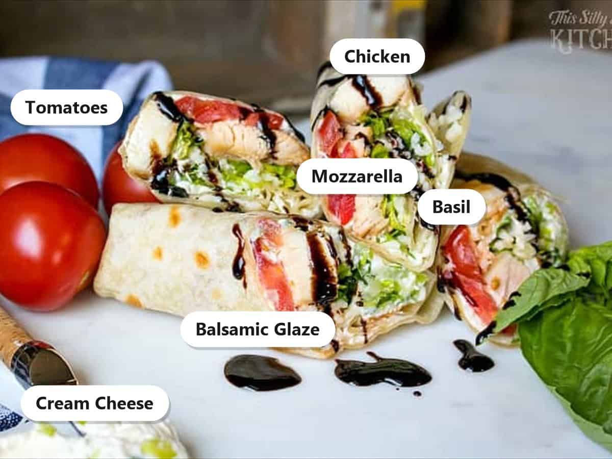Labeled caprese chicken wrap fillings including chicken, tomatoes, mozzarella, basil, cream cheese, and balsamic glaze.