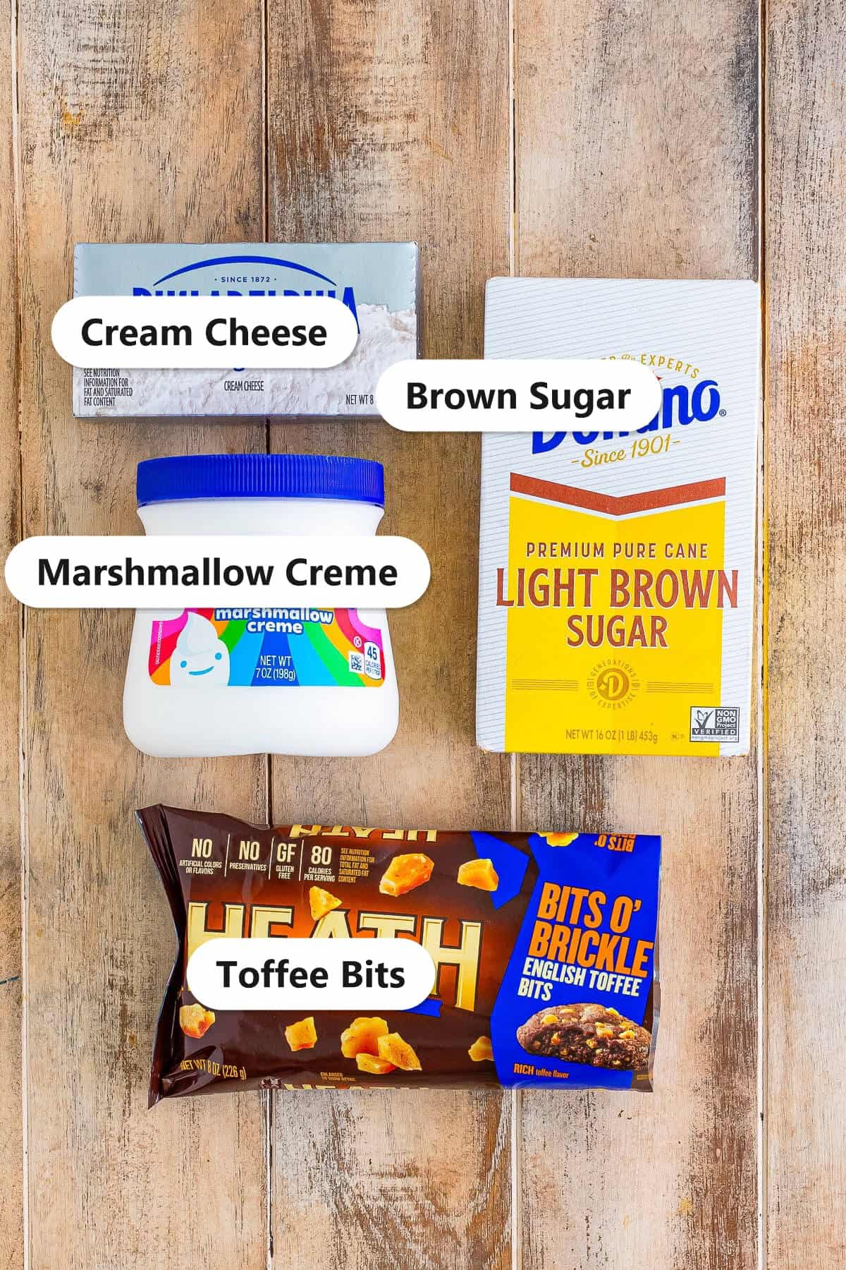 Labeled ingredients for caramel apple dip including cream cheese, brown sugar, marshmallow creme, and toffee bits.