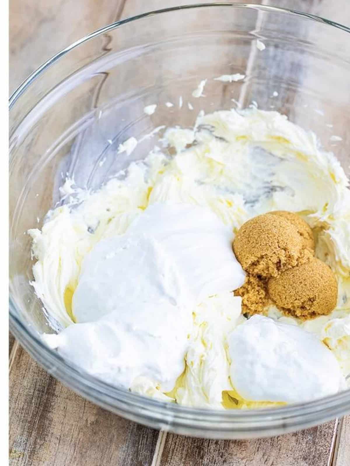 Adding marshmallow creme and brown sugar to whipped cream cheese.