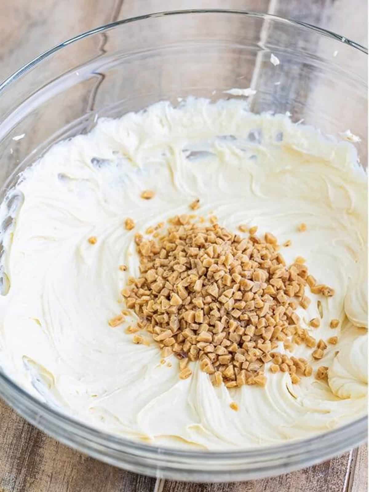 Folding toffee bits into the caramel apple dip.