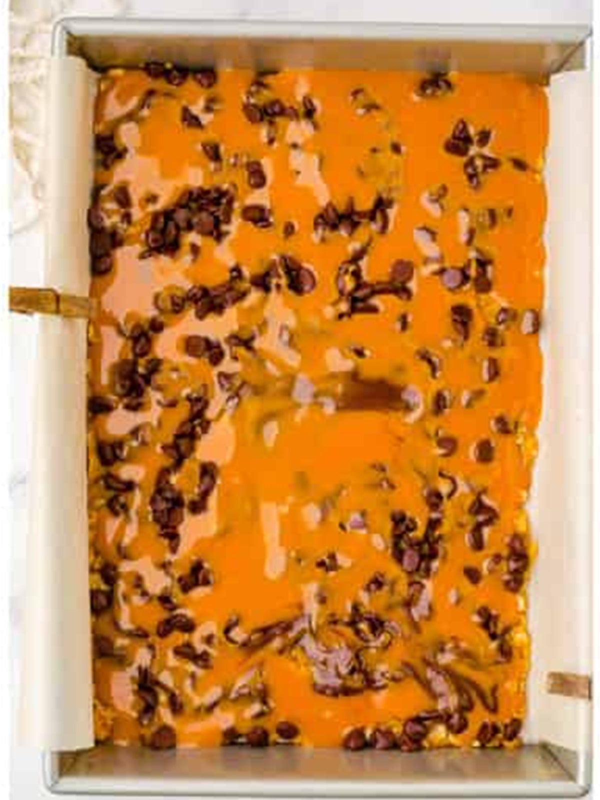 Melted caramel poured over the chocolate chips in the Carmelitas pan.