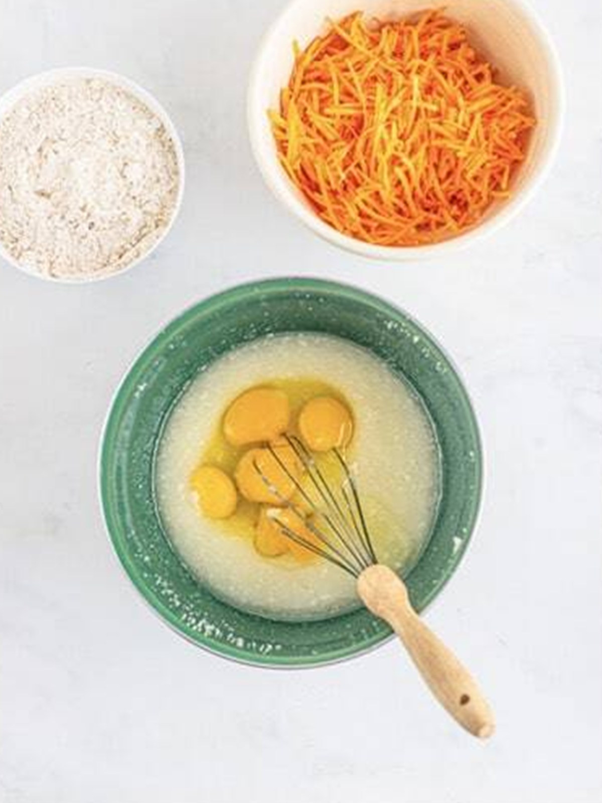 Eggs and egg yolks whisked into the carrot bundt cake batter.