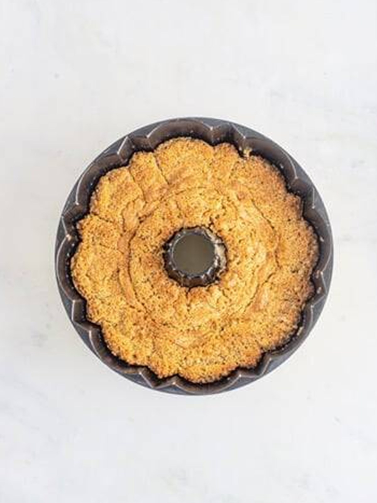 Baked carrot bundt cake golden brown in the pan.