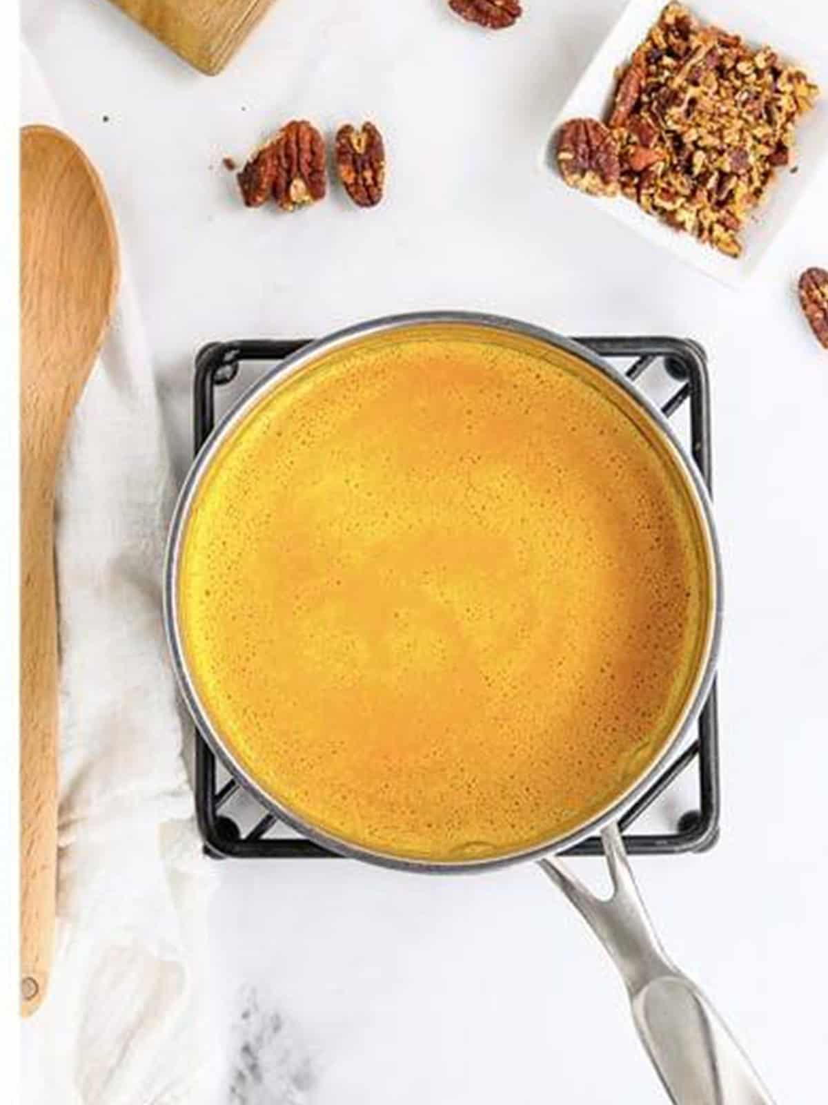 Smooth, creamy carrot soup in a pot ready to serve.