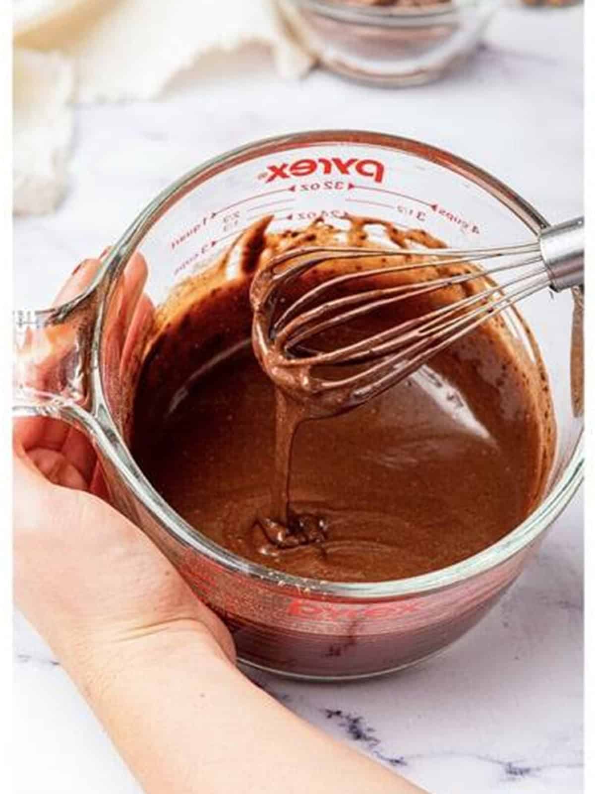 Whisking the chocolate mug cake batter until smooth.