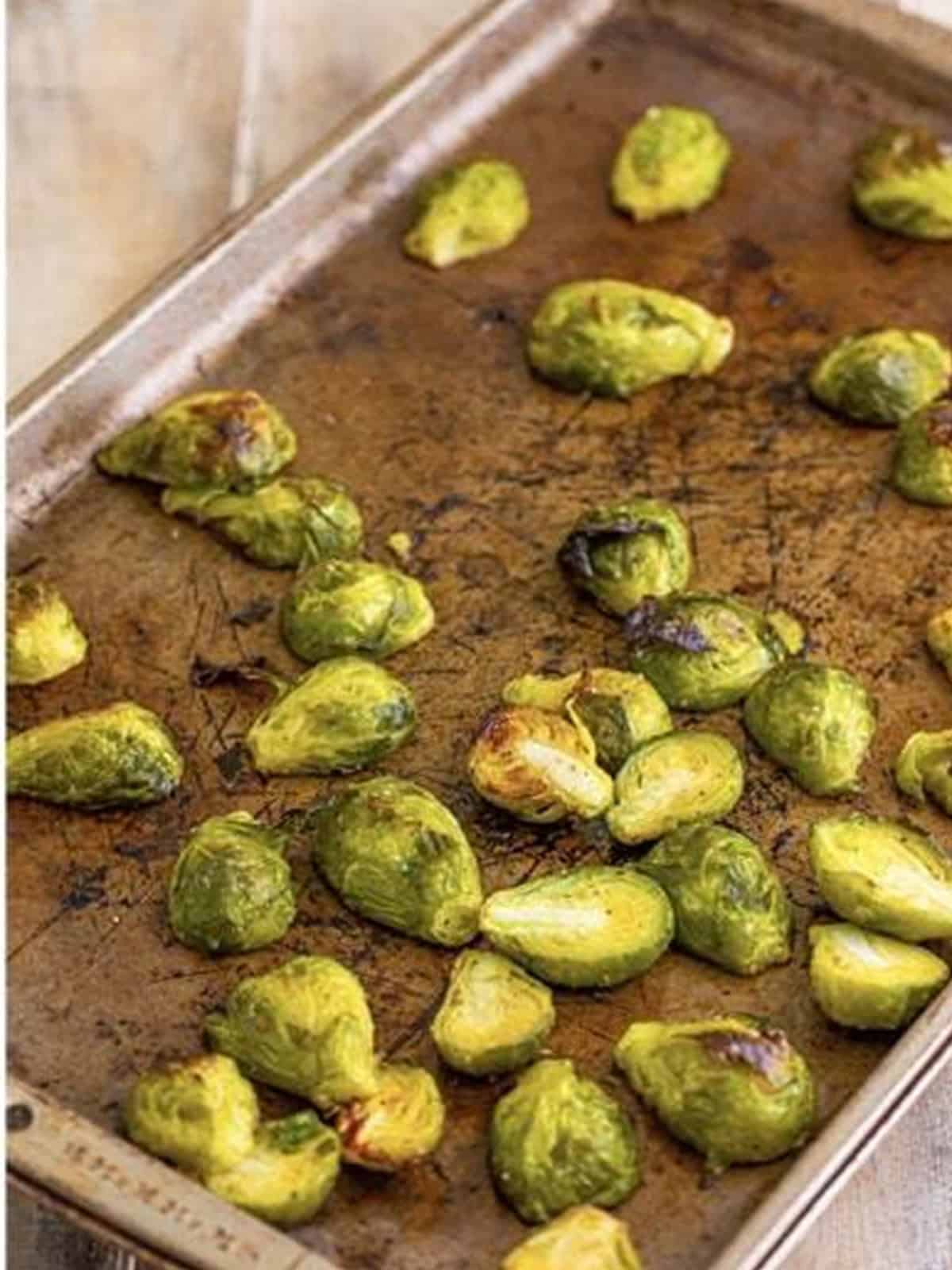 Roasted Brussels sprouts browned on a baking sheet.