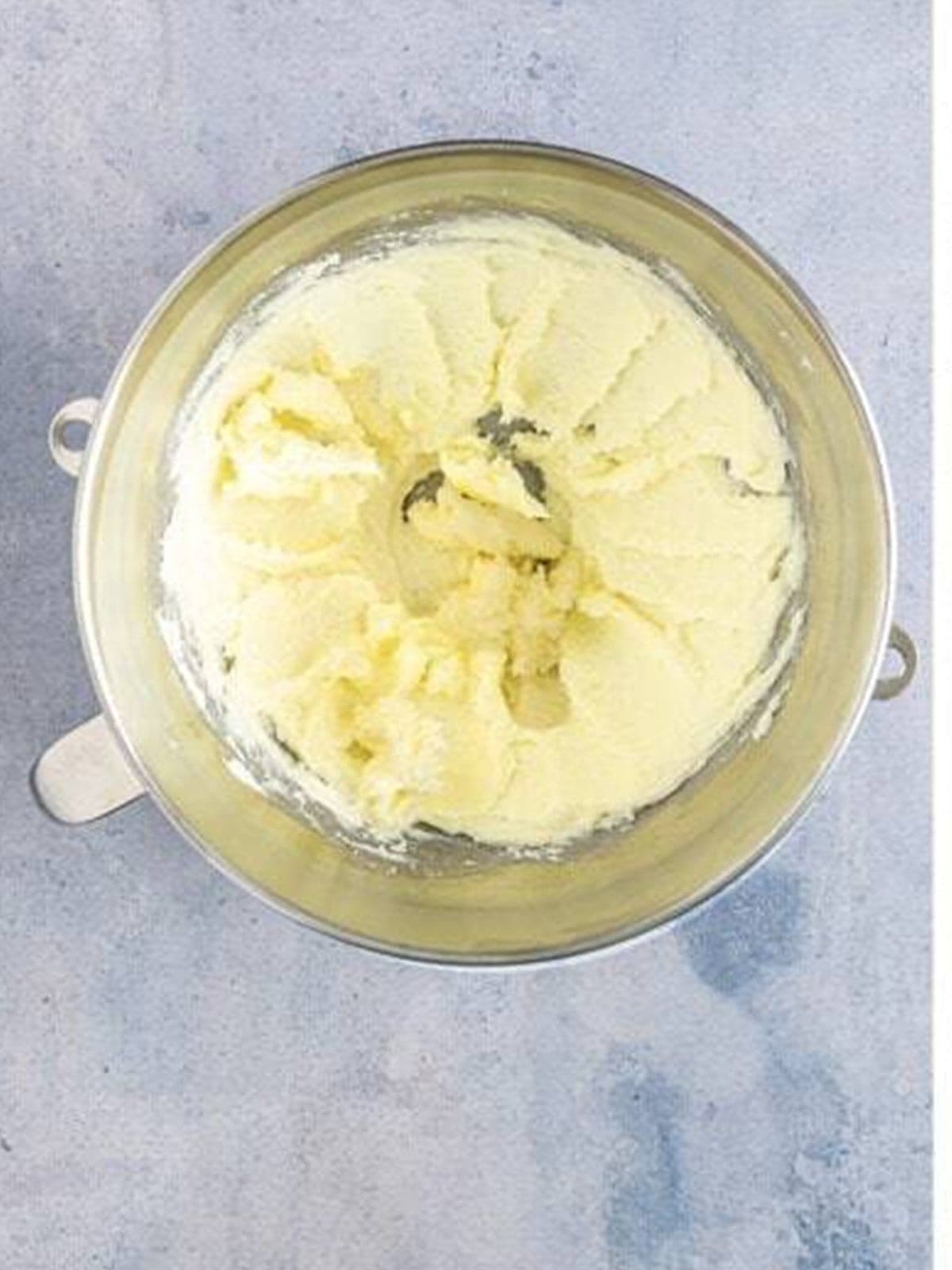 Creaming butter and sugar in a stand mixer bowl.