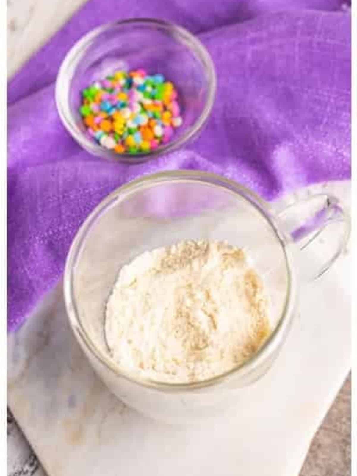 The dry ingredients combined in the mug.