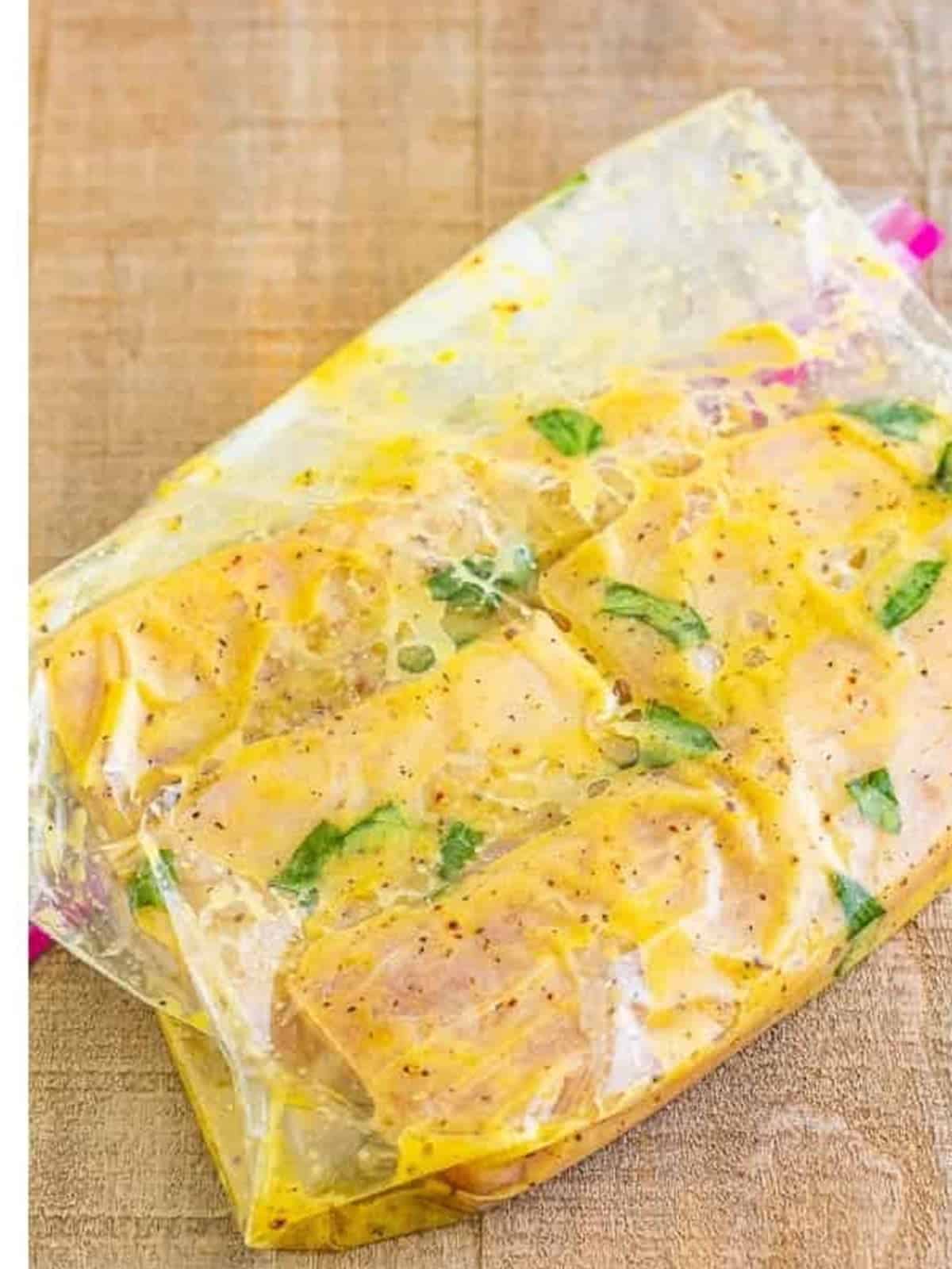 Mahi filets marinating in the Italian marinade in a zip-top bag.