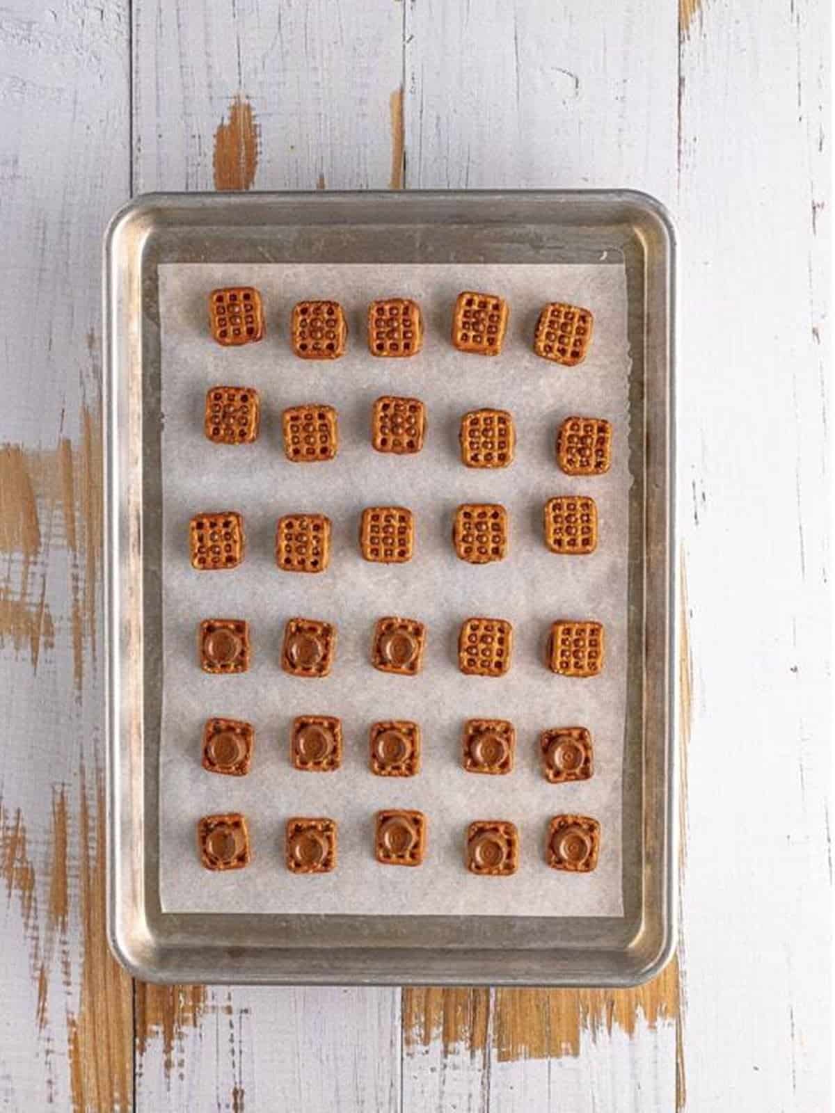 Softened Rolos topped with a second pretzel and pressed down.