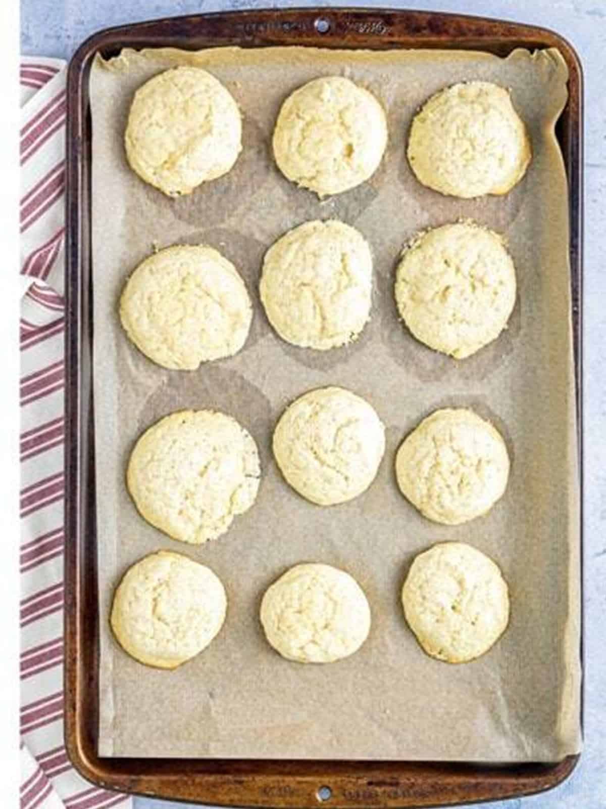 Baked cinnamon tea cakes golden on the baking sheet.