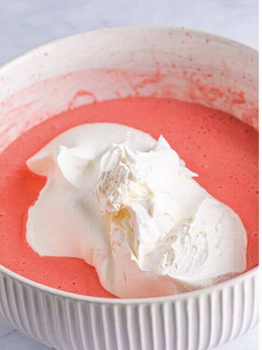 Whipped topping added to the pink jello and cream cheese mixture.