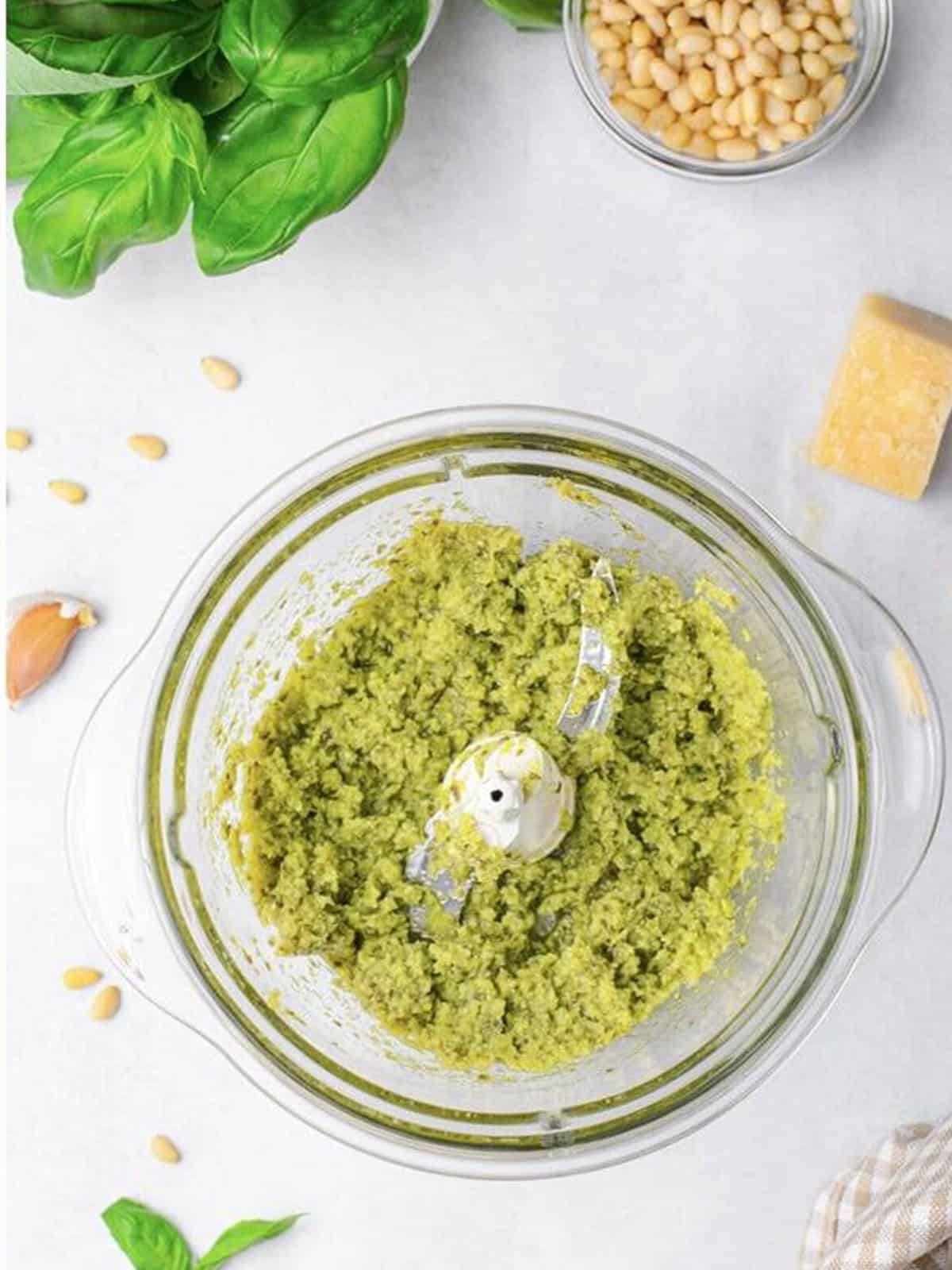 Fresh basil parmesan pesto blended in a food processor for stuffing challah bread.