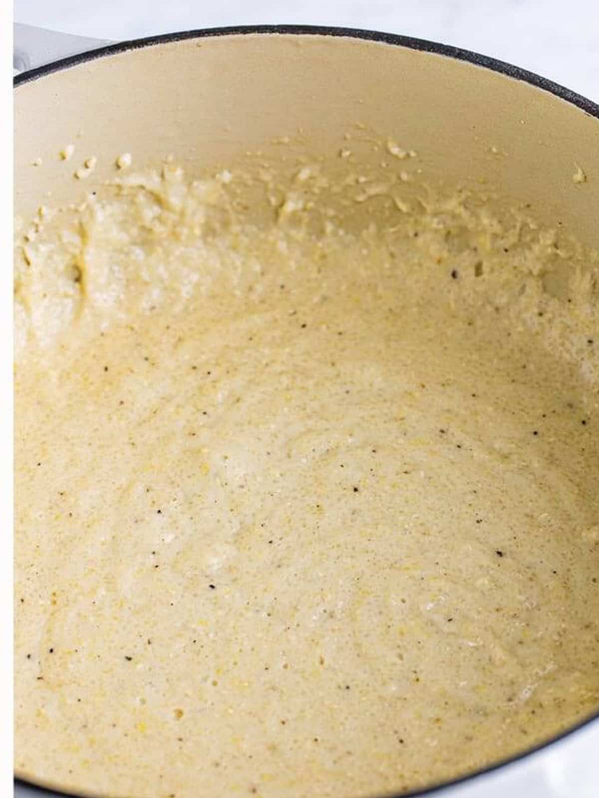 Grits simmered until thick and creamy in the pot.