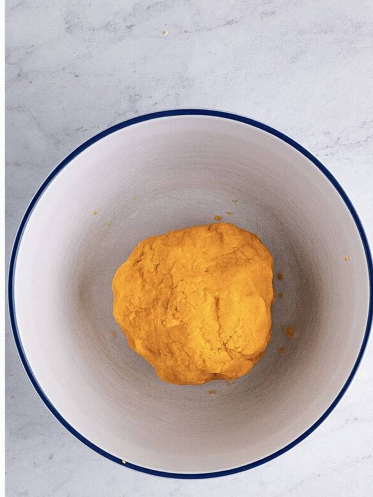 Homemade Cheez-It cracker dough formed into a smooth ball.