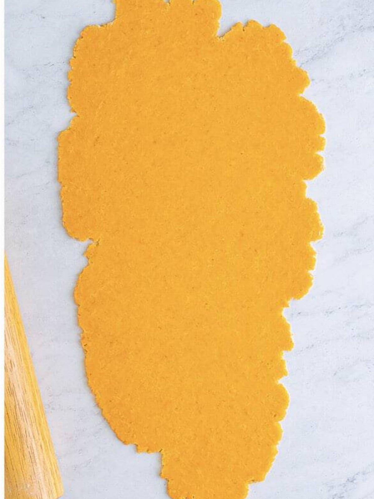 Cheez-It cracker dough rolled out thin into a rectangle.