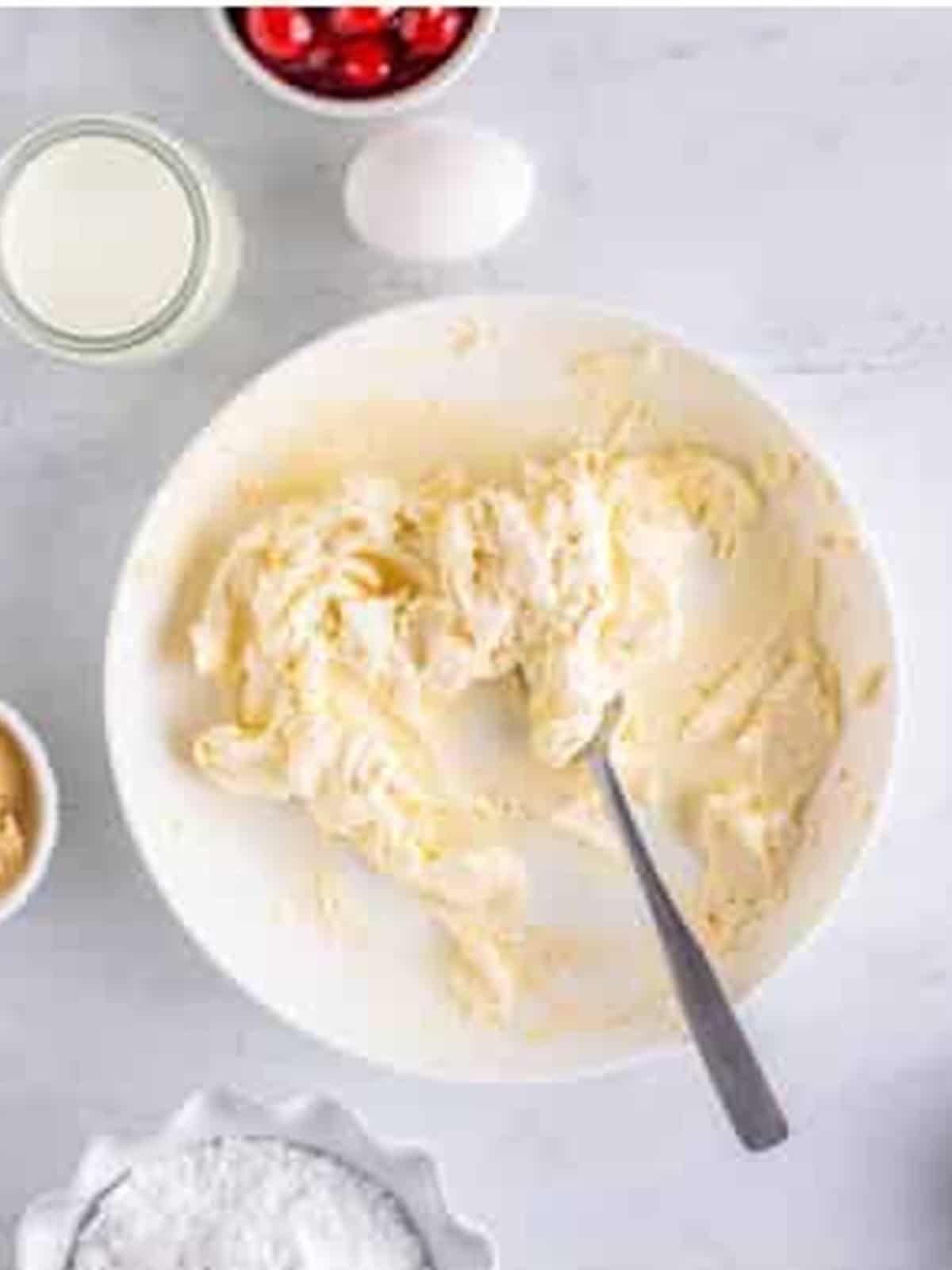 Cream cheese, sugar, and vanilla mashed together with a fork for Cherry Danish filling.