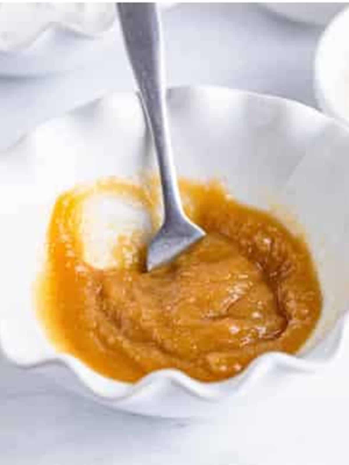 Brown sugar and melted butter mixed in a bowl for Cherry Danish crumble.