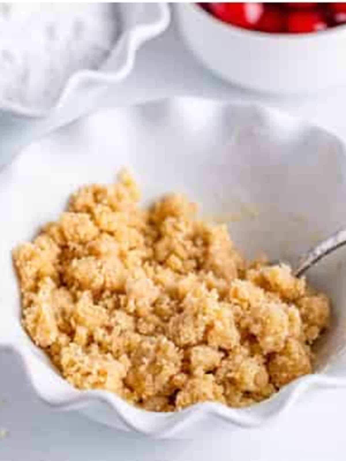 Flour stirred into the brown sugar mixture making a crumble for Cherry Danish.