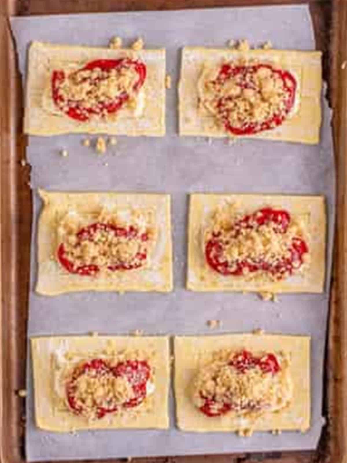 Brown sugar crumble sprinkled over the cherries on each Cherry Danish.