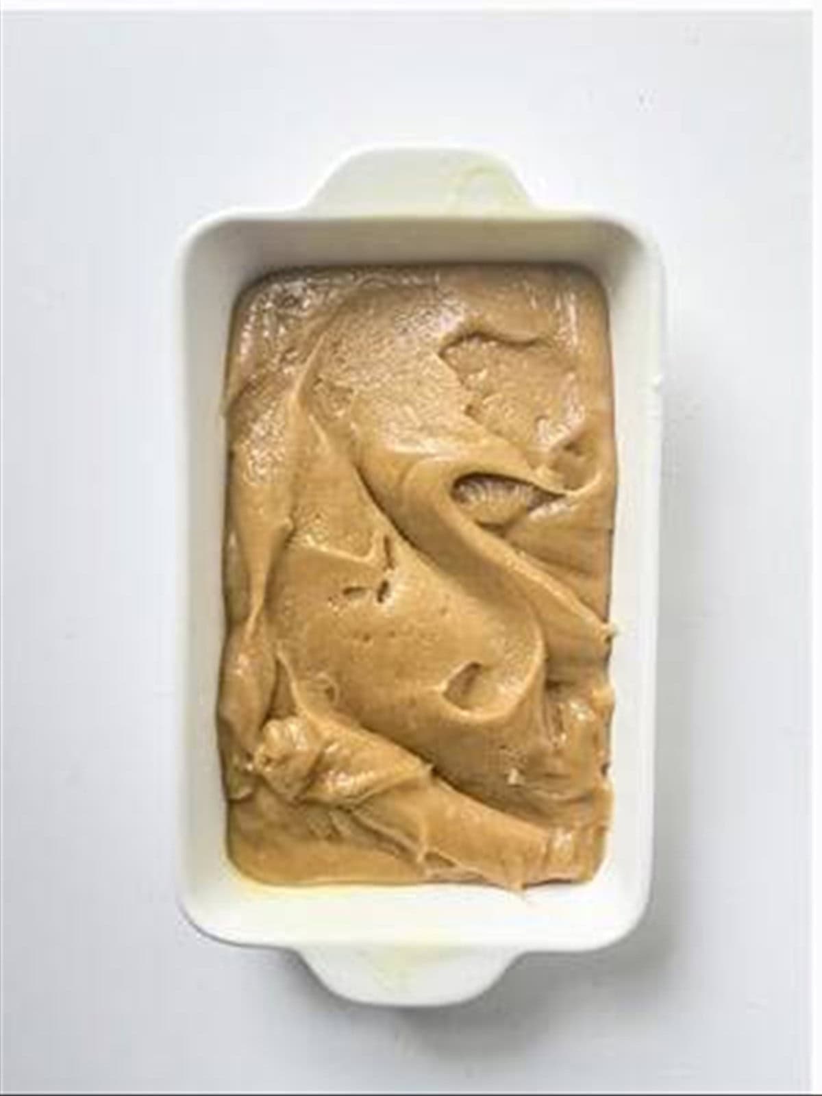 Blondie batter spread in a baking dish.