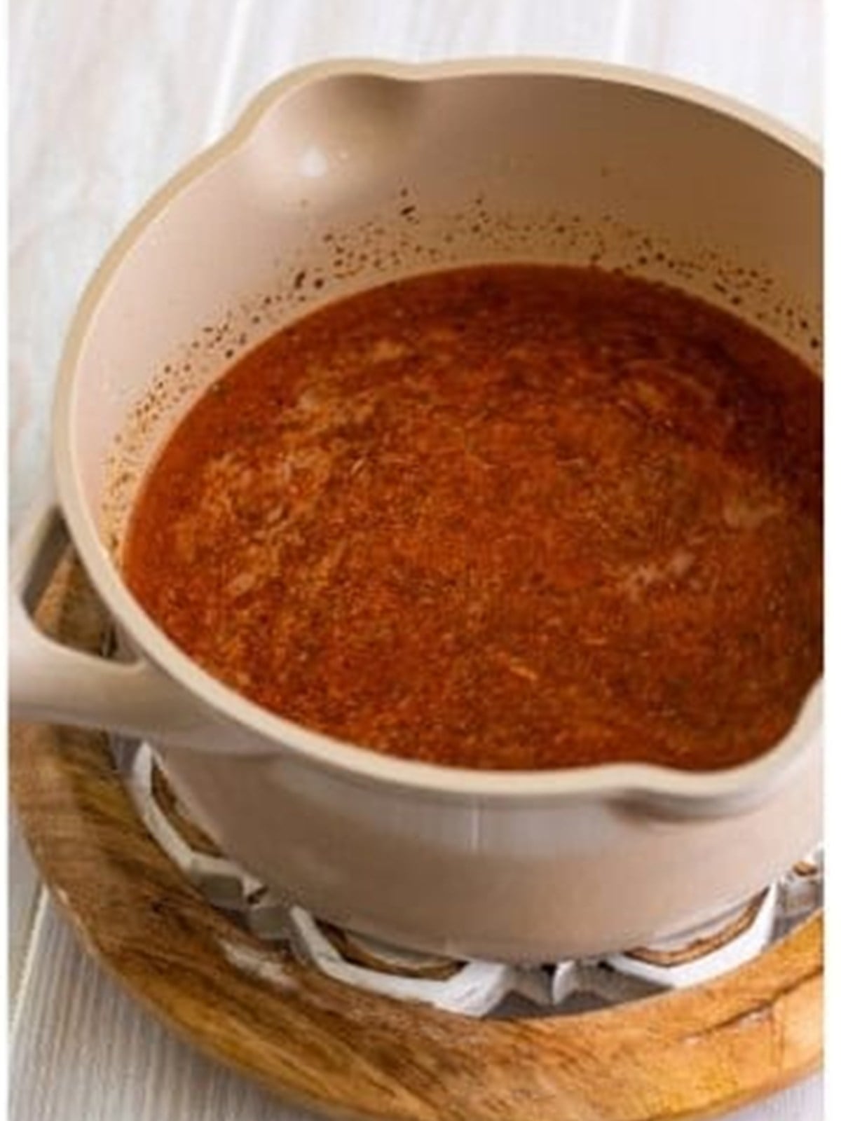 Chicken stock whisked into the roux for chicken enchiladas sauce.