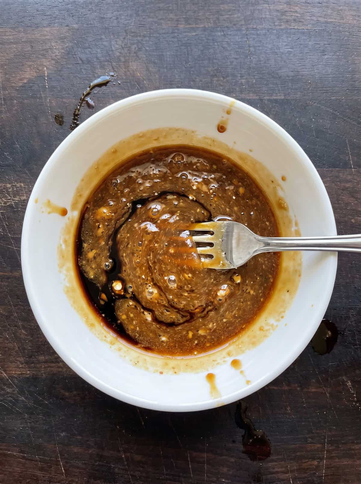 Pad thai sauce of soy sauce, fish sauce, and cornstarch whisked together in a bowl.
