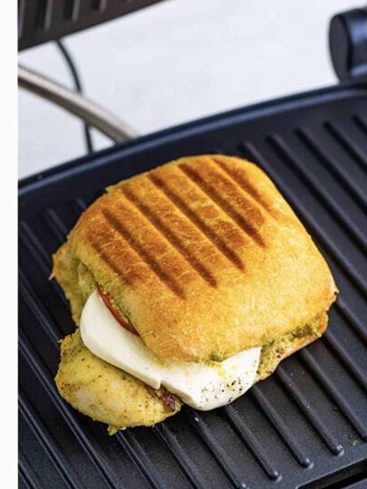 Finished pressed chicken pesto sandwiches ready to serve.