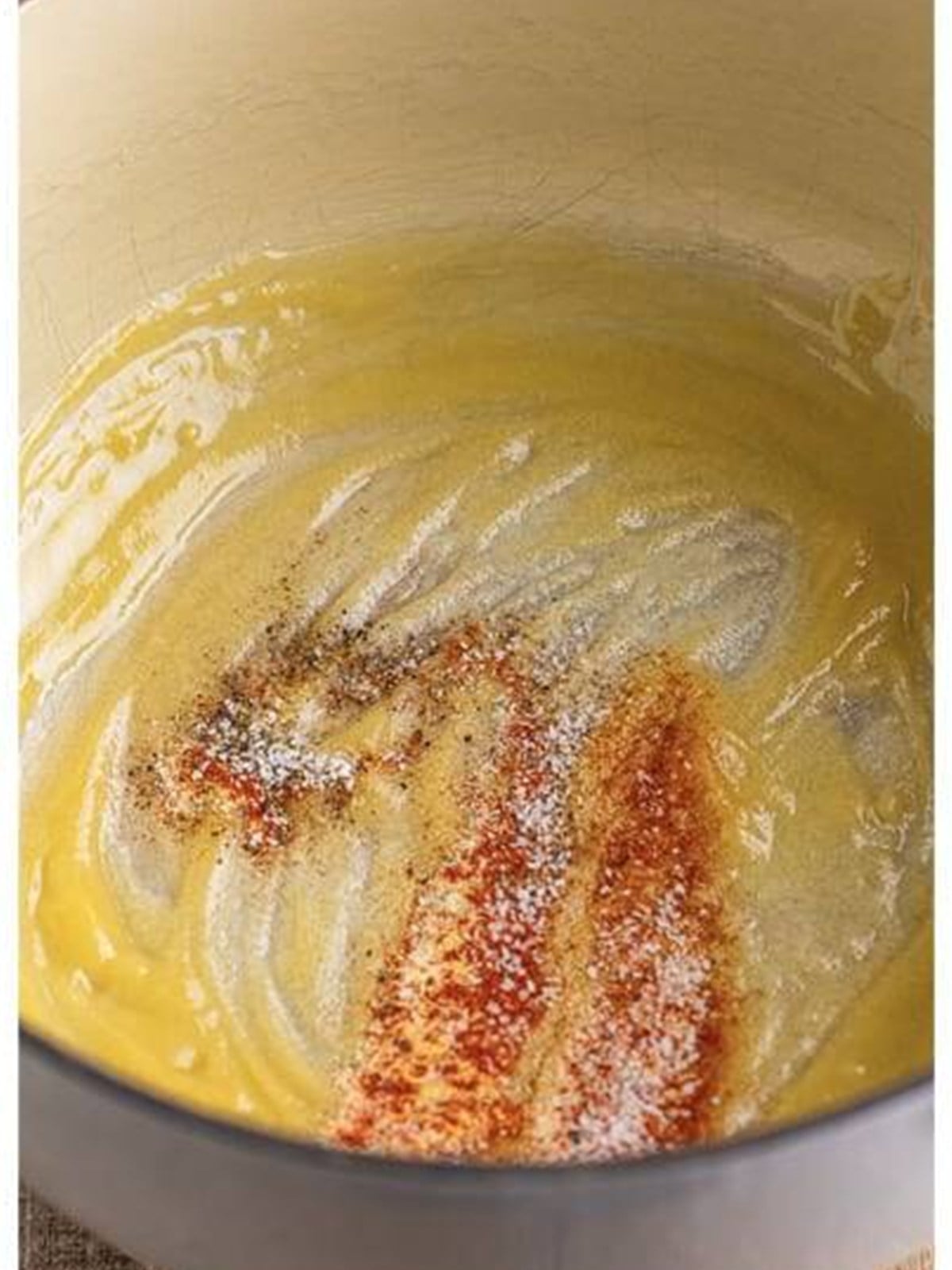Butter, flour, and seasonings whisked into a roux for the cheese sauce.