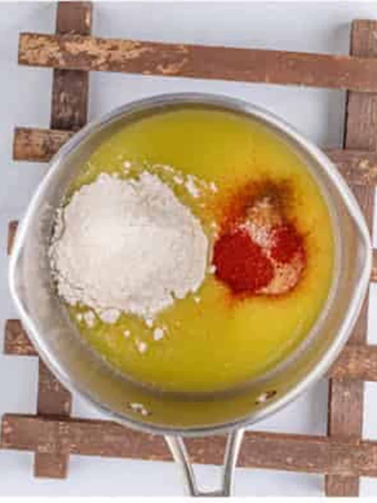 Butter, flour, and paprika whisked into a roux for the cheese sauce.