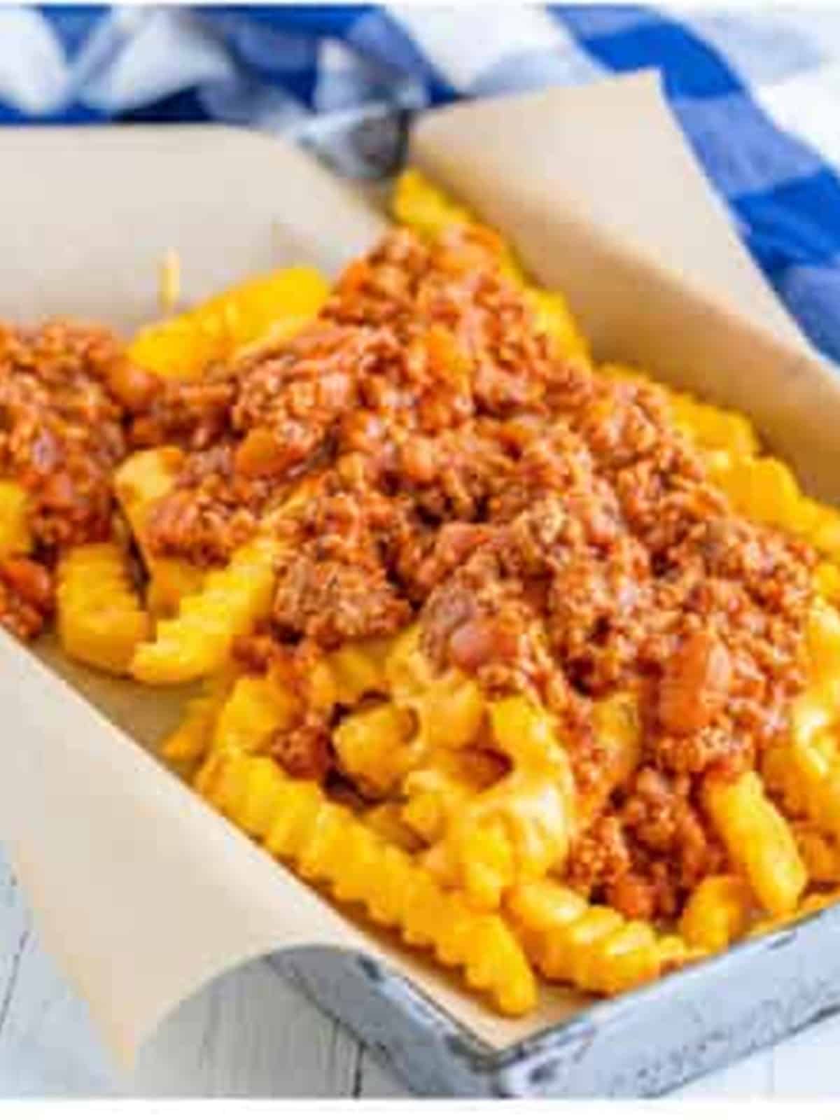Baked fries topped with cheese sauce and chili to make chili cheese fries.