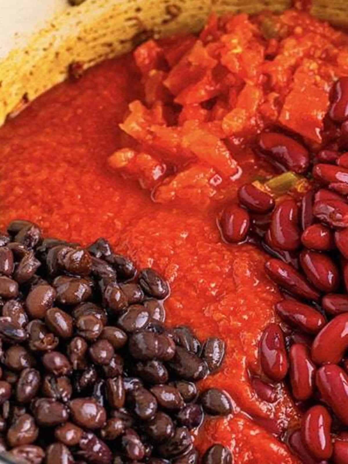 Crushed tomatoes, diced tomatoes, black beans, and kidney beans added to chili mac.