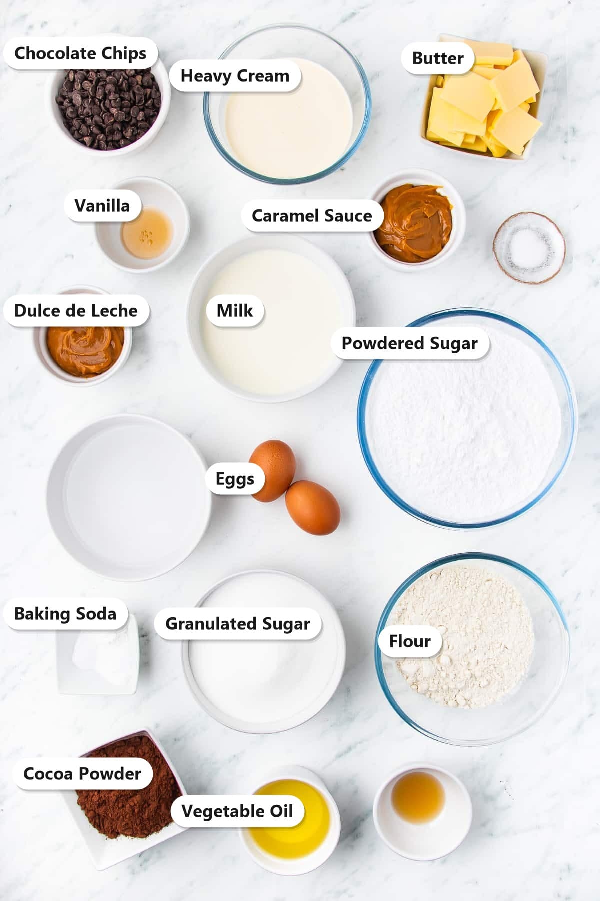 Labeled chocolate caramel cake ingredients including flour, cocoa, butter, caramel, and chocolate chips.