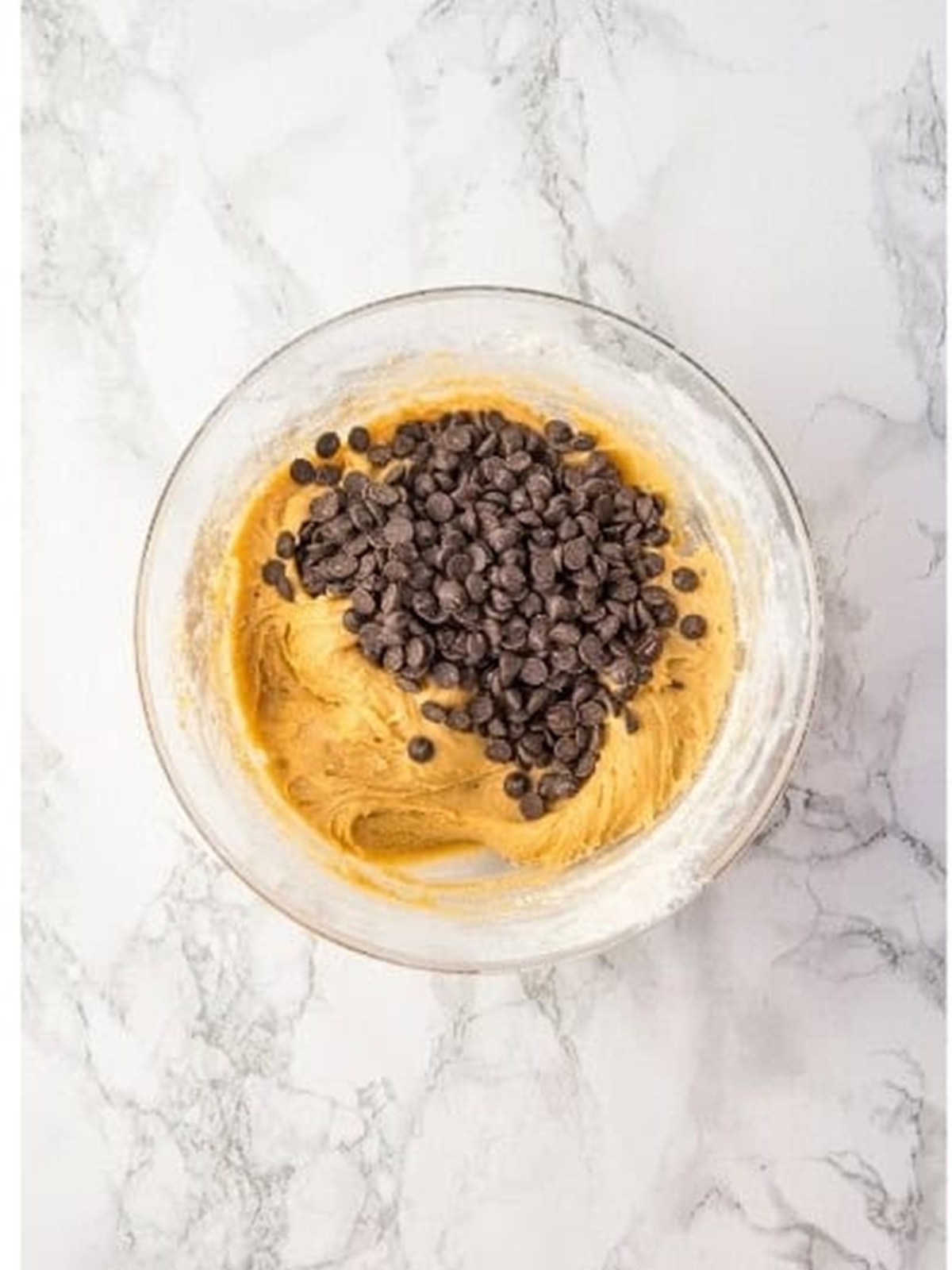 Folding chocolate chips into the Chocolate Chip Cookie Bars dough.