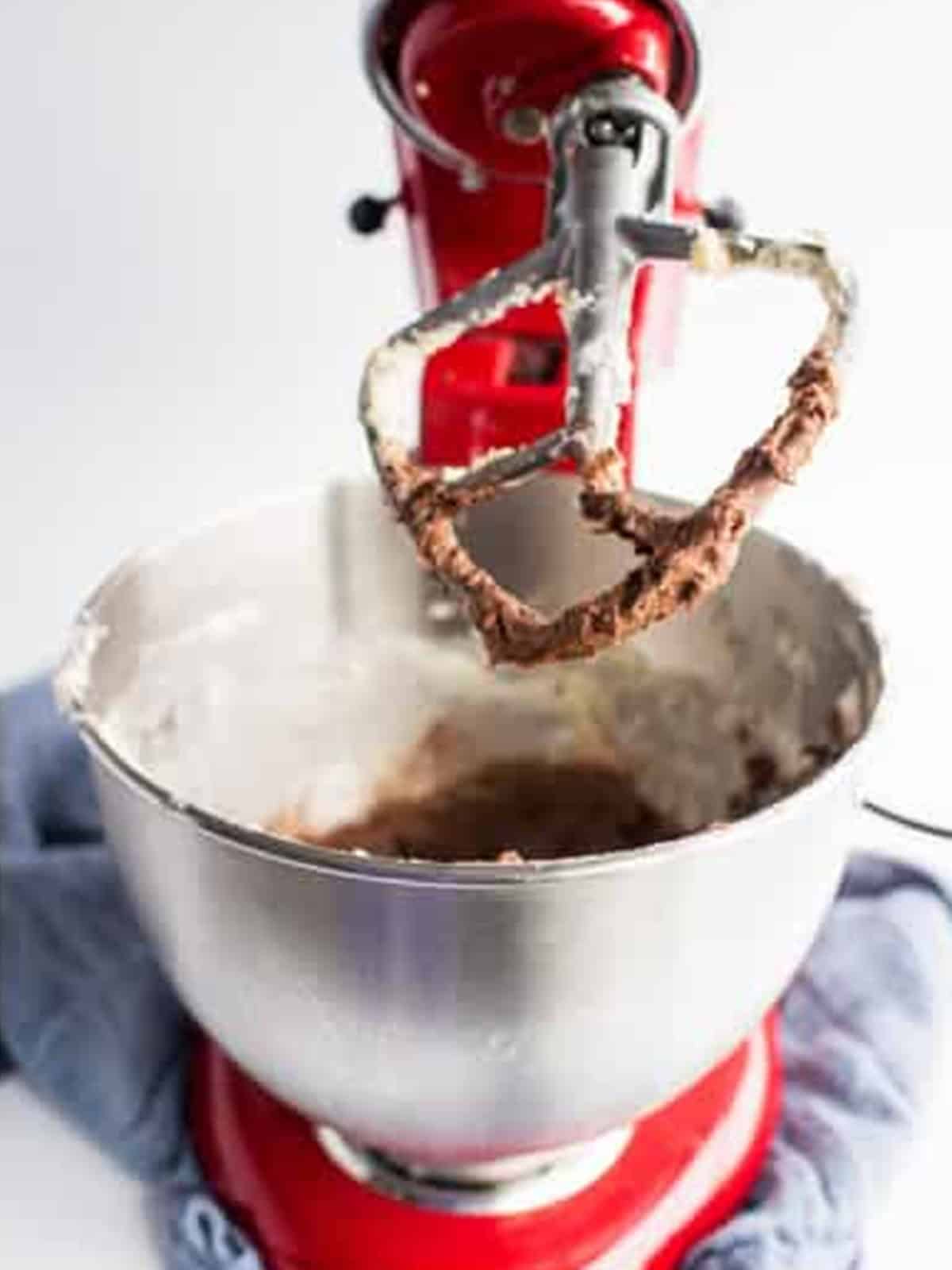 Chocolate buttercream whipped in a stand mixer for Chocolate Chip Cookie Sandwiches.