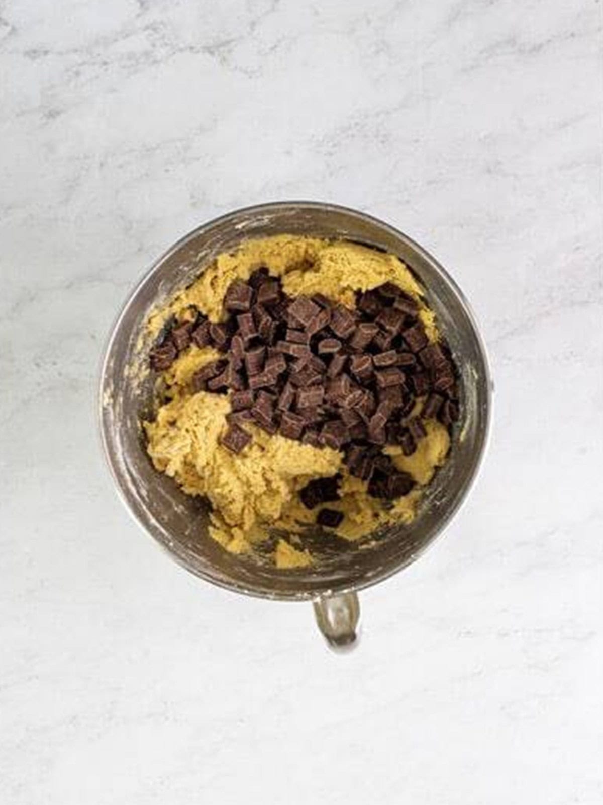 Chocolate chunks folded into the chocolate chunk cookie dough.