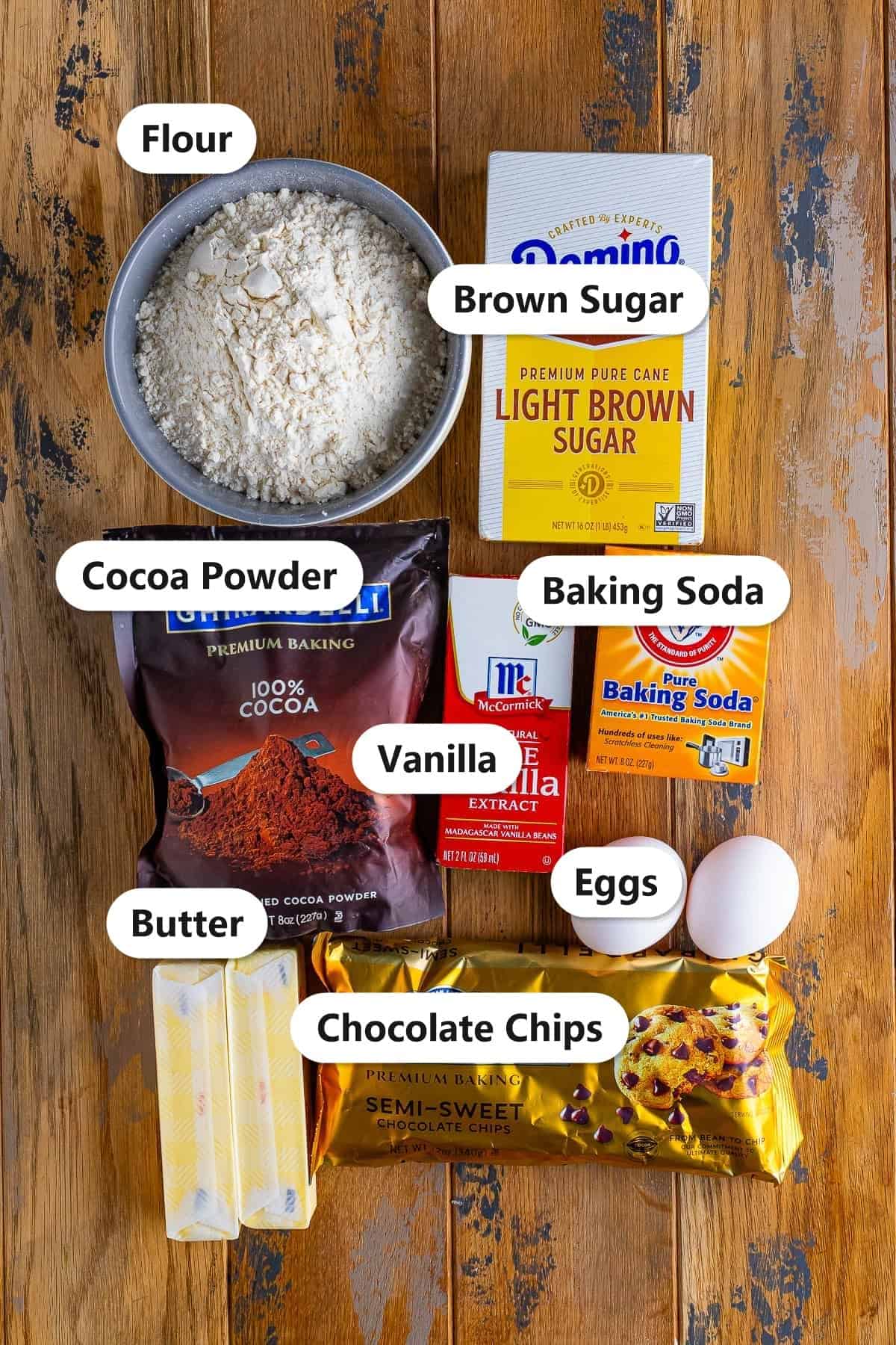Labeled chocolate cookie bars ingredients including flour, cocoa powder, brown sugar, butter, eggs, vanilla, baking soda, and chocolate chips.