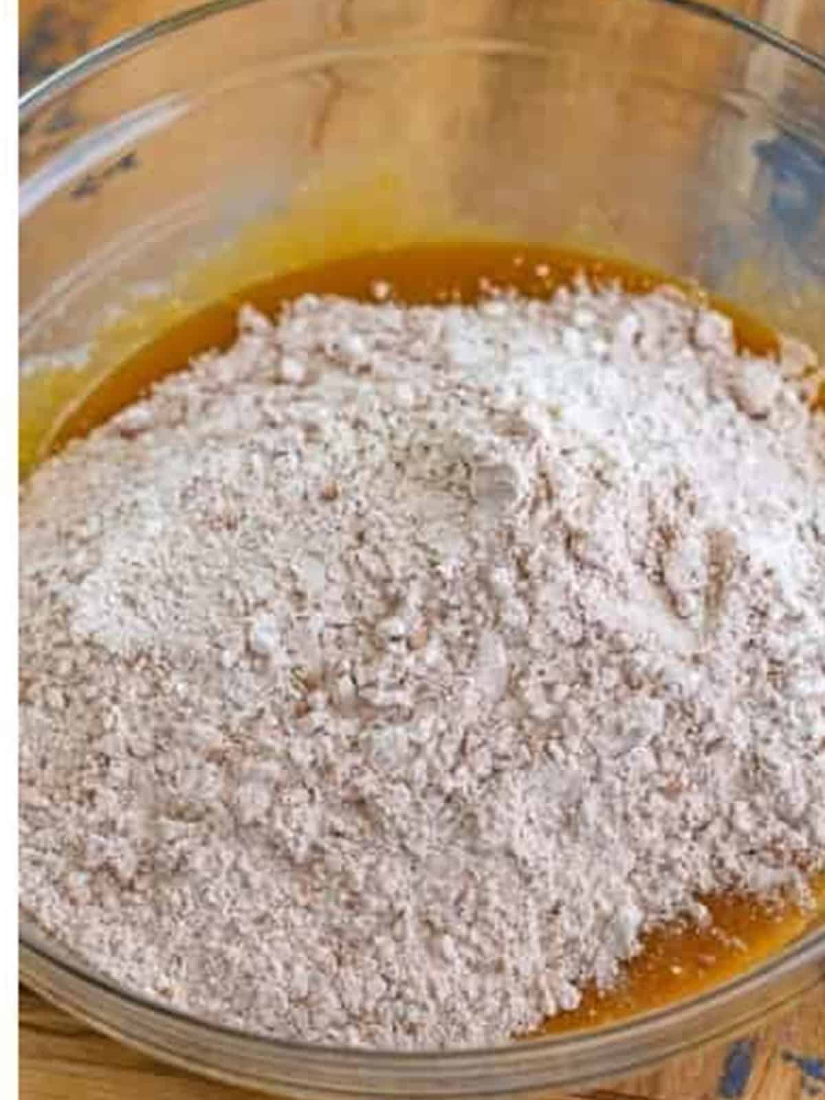 Stirring the dry flour mixture into the chocolate cookie bar dough.