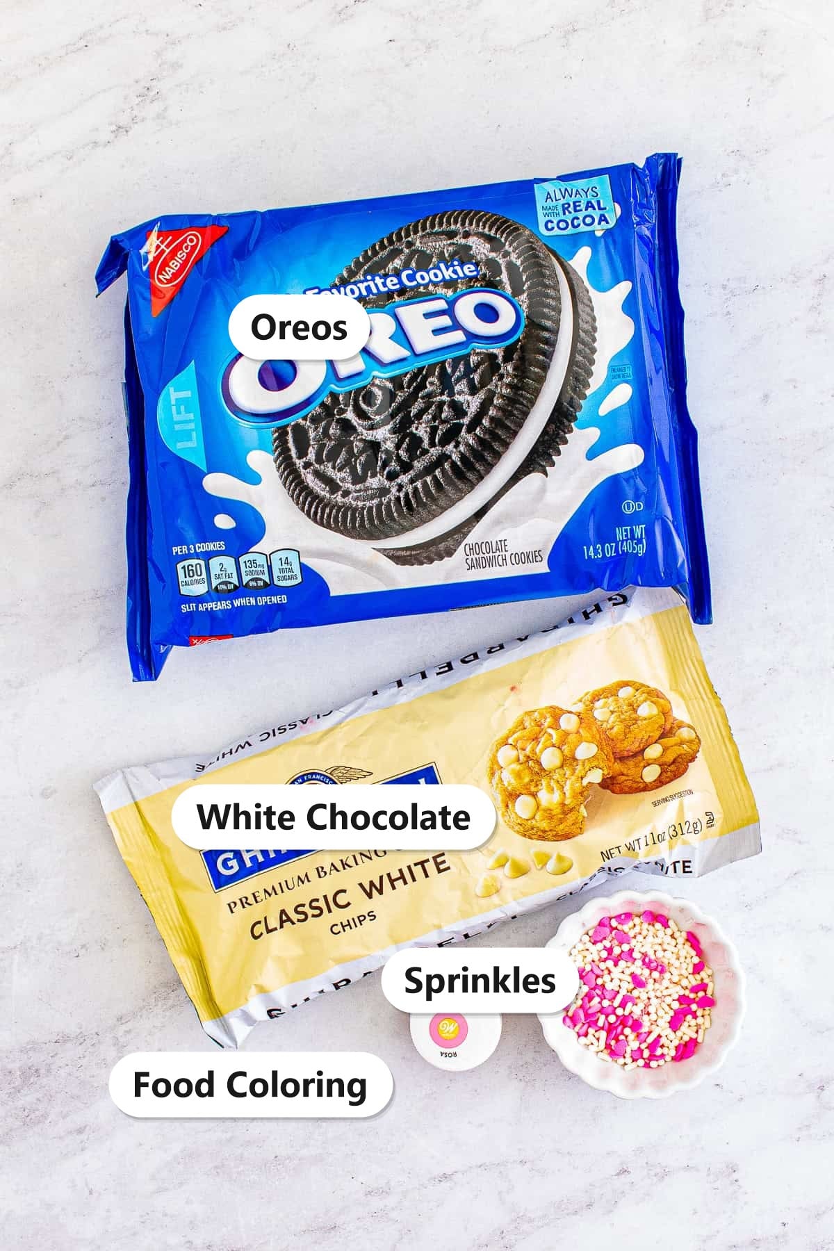 Labeled ingredients for chocolate covered Oreos: Oreos, white chocolate candy melts, food coloring, and sprinkles.